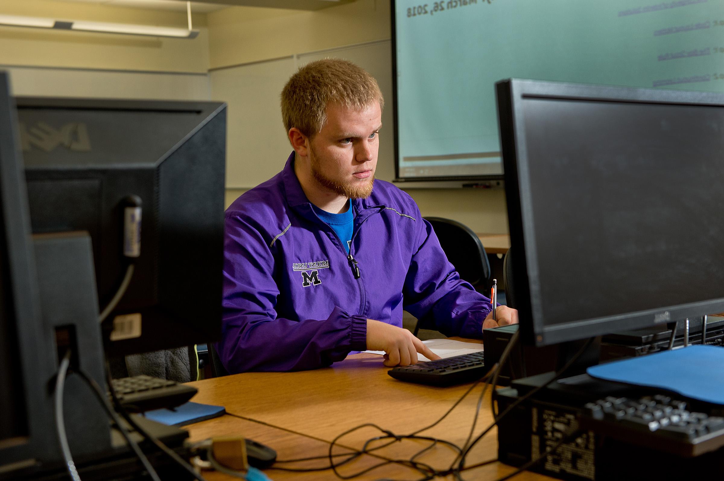 student looking at computer